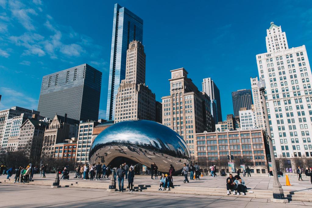 the bean at the millenium park Chicago on a bright and busy saturday by Shannon Purcell